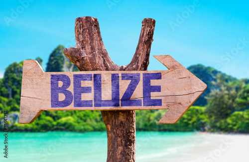Belize wooden sign with beach background photo