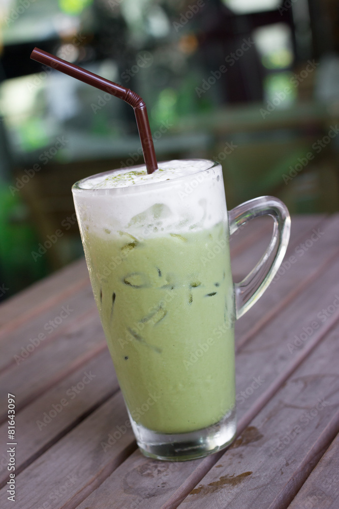 Glass of iced green tea latte. Glass of iced green tea latte.
