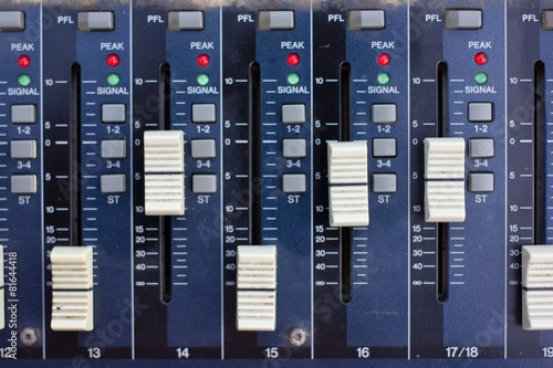 Audio sound mixer with buttons and sliders.