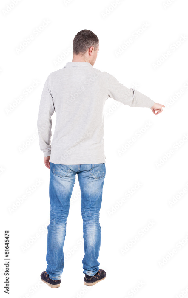 Back view of pointing young men in shirt and jeans. Back view of pointing young men in shirt and jeans.