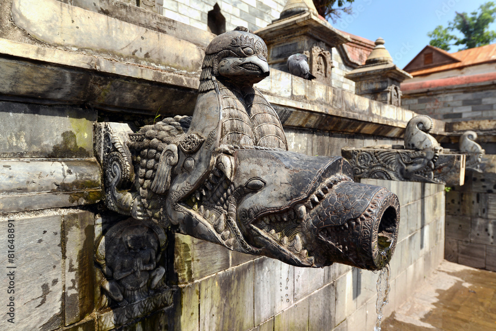 Carved stone public fountain in Pashupatinath, Nepal