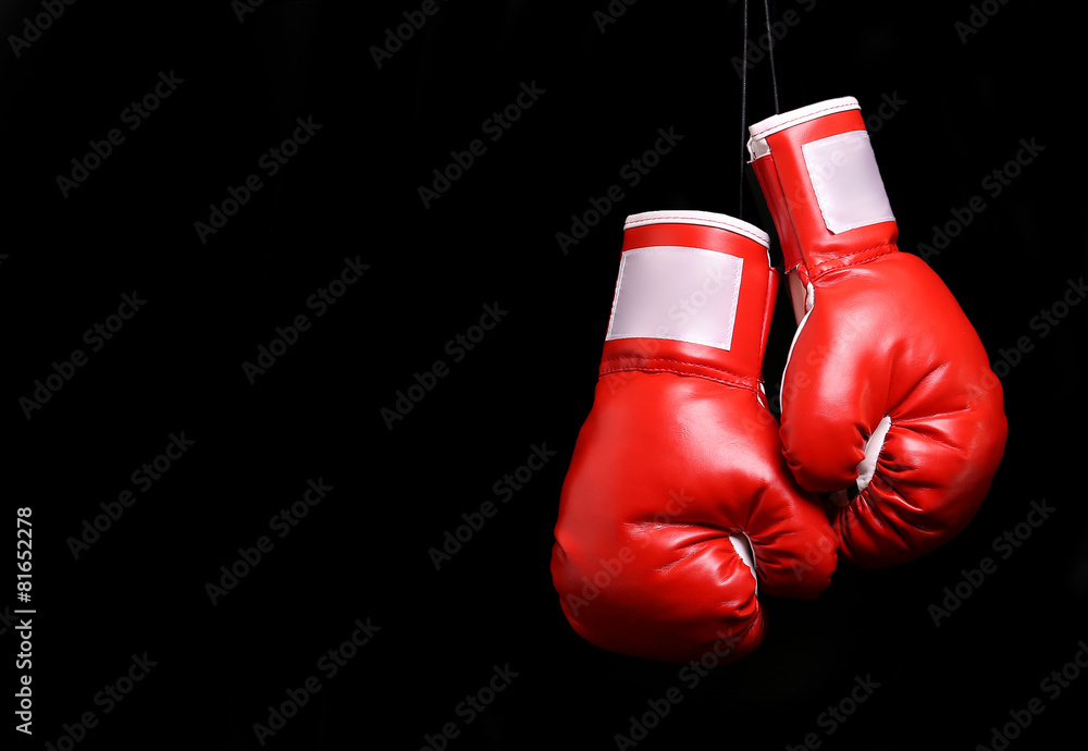 Boxing gloves over black backround