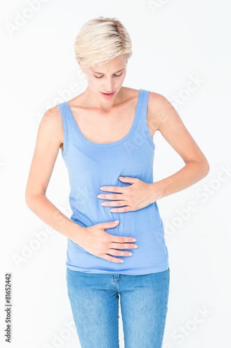 Casual woman with stomach pain