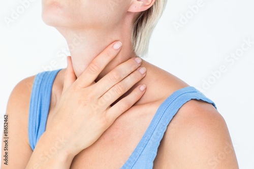 Blonde woman suffering from throat pain