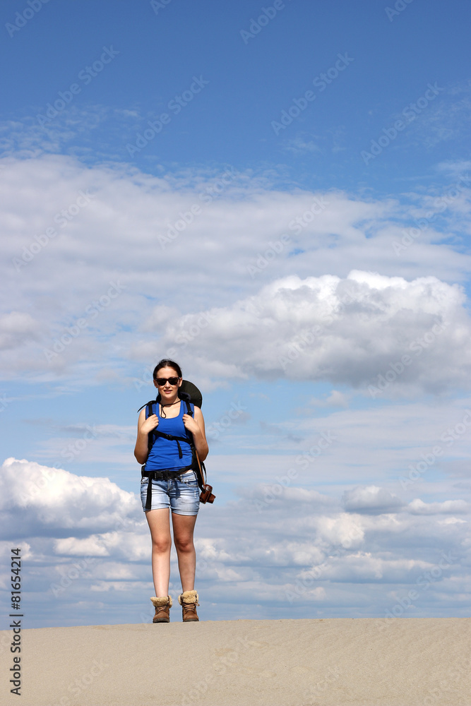 beautiful girl hiker walking in the desert