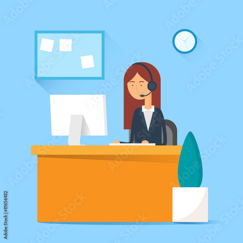 Call center operator sitting at the table in the office