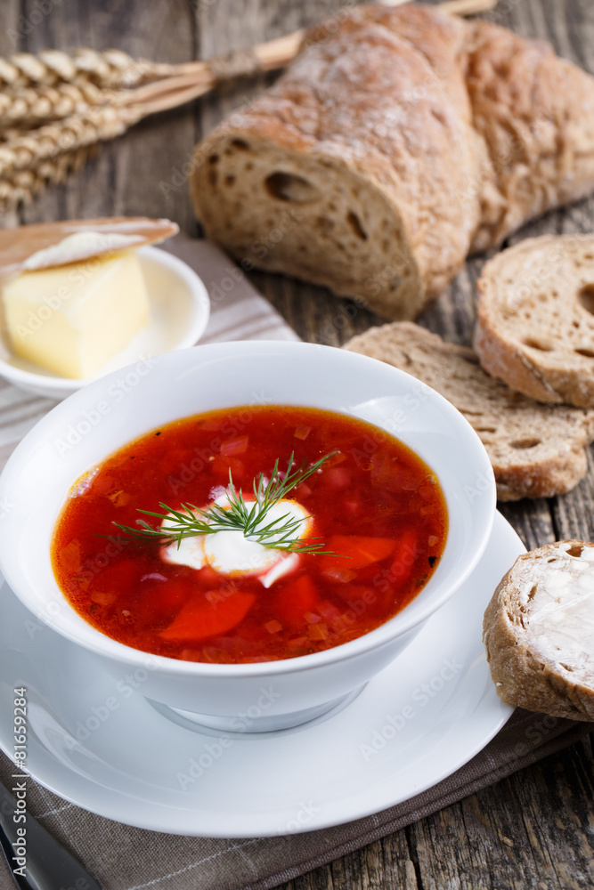 Tasty soup with bread on a wooden background. Tasty soup with bread on a wooden background.