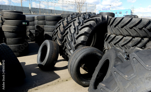 tires stacked in a yard photo
