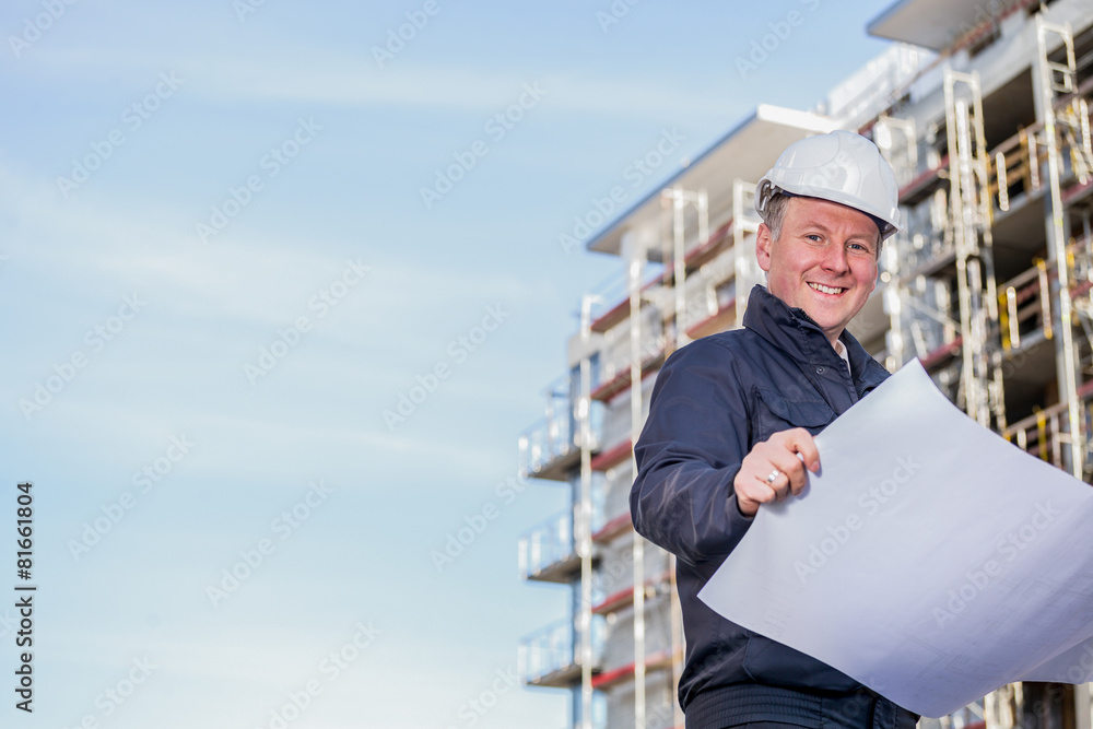 Construction manager with blueprints Construction manager with blueprints