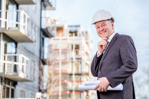 Construction manager with blueprints