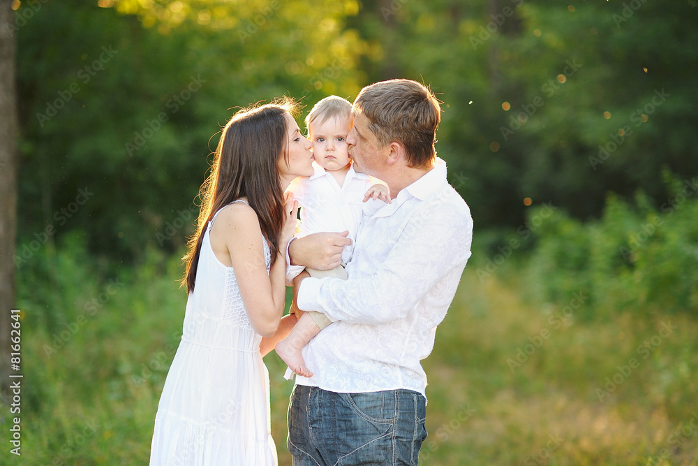portrait of a happy family in summer nature portrait of a happy family in summer nature