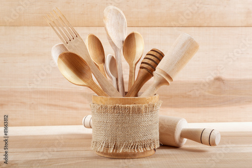 Foto Set of kitchen utensils on wooden board.