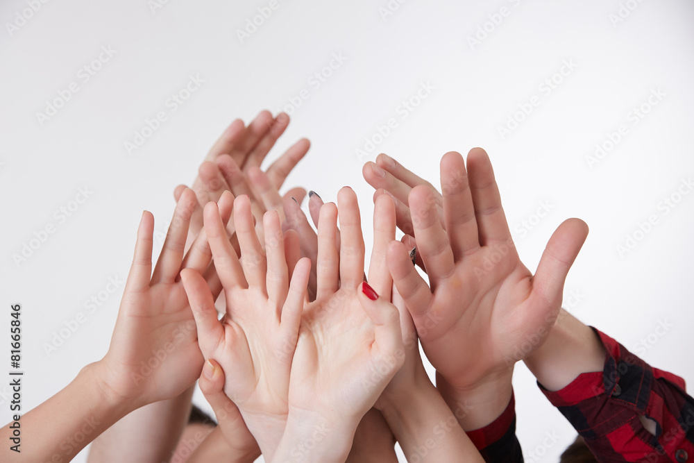 many hands reaching up