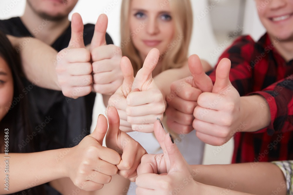 Fototapeta premium a group of students showing thumb