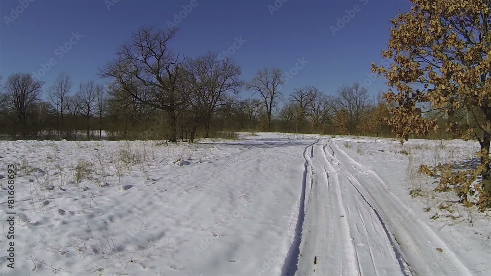 flight over car traces on snow-covered field. Aerial flight over car traces on snow-covered field. Aerial