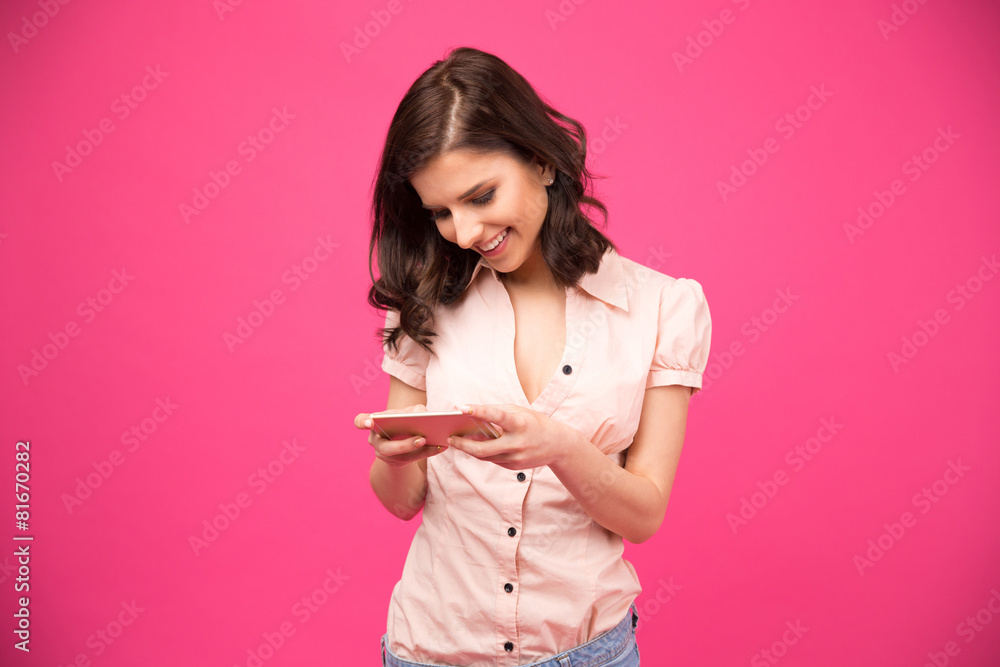 Smiling young woman using smartphone Smiling young woman using smartphone