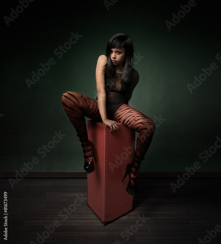 gothic girl sitting on top with open legs