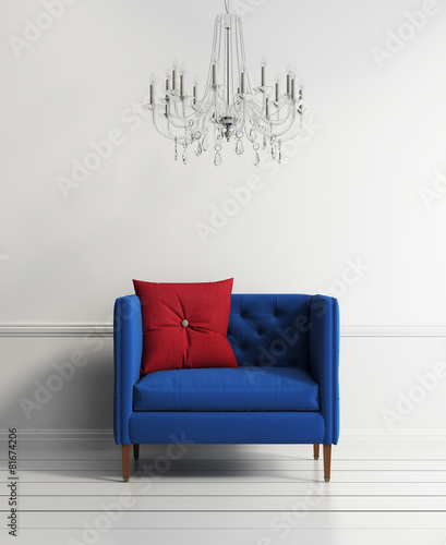 Blue buttoned couch in a white interior