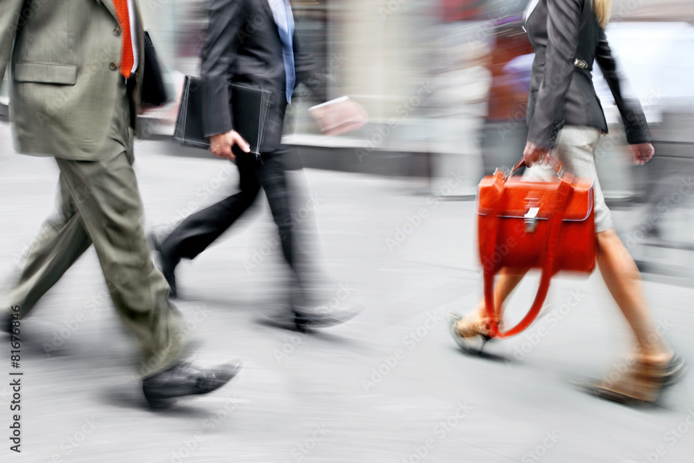 motion blurred business people walking on the street motion blurred business people walking on the street