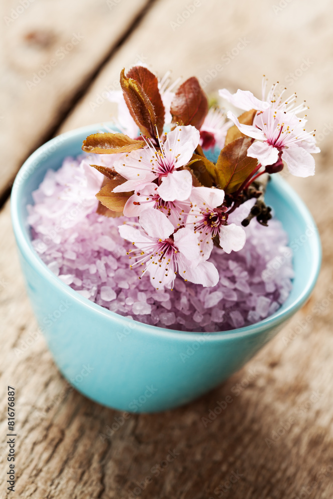 Spa concept: bowl with bath salt and flowers
