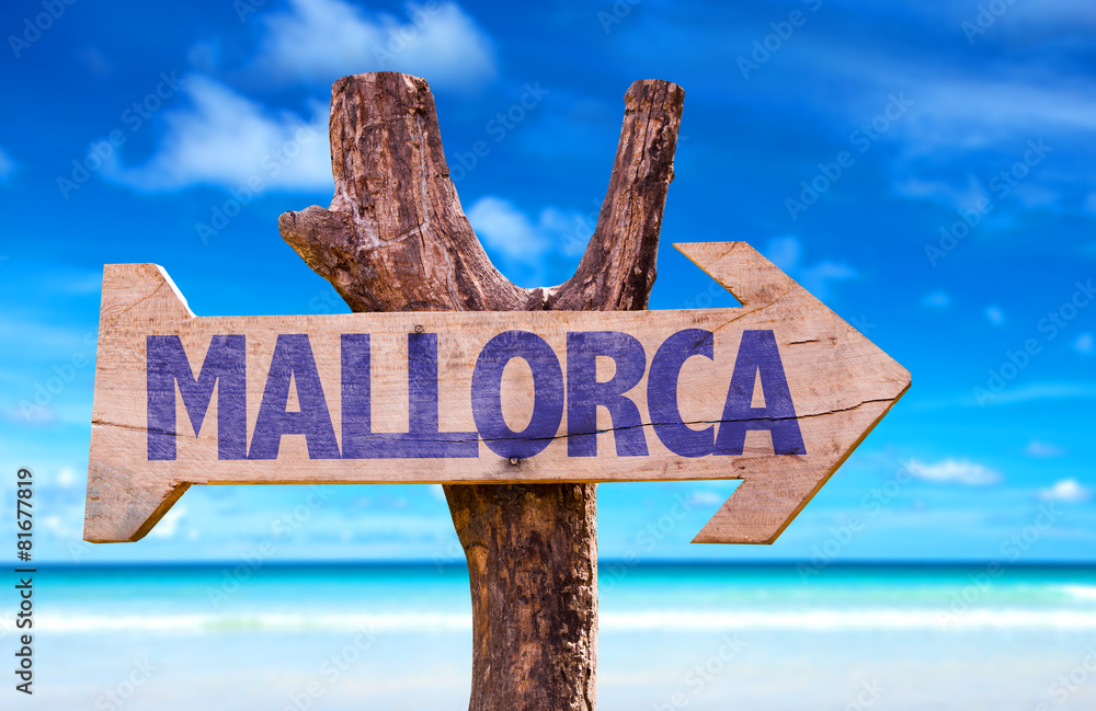 Mallorca wooden sign with beach background