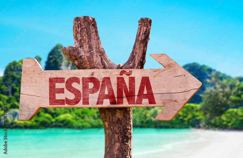 Spain (in Spanish) wooden sign with beach background