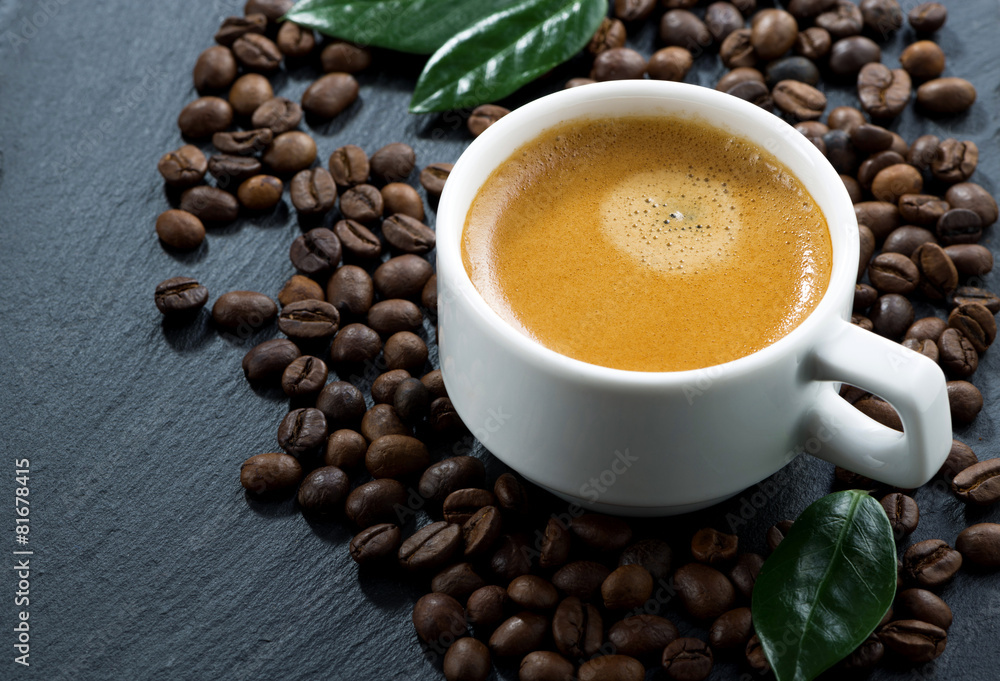 cup of espresso on coffee beans background, horizontal cup of espresso on coffee beans background, horizontal