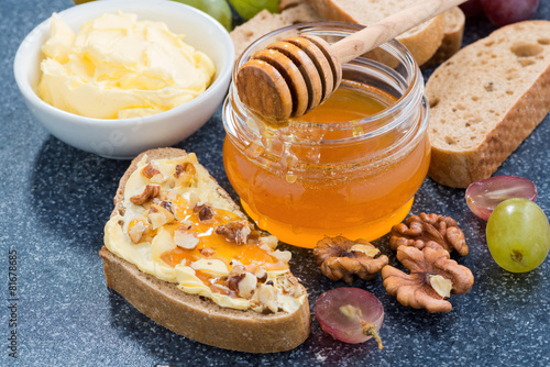 honey, bread with butter and grape, horizontal, top view