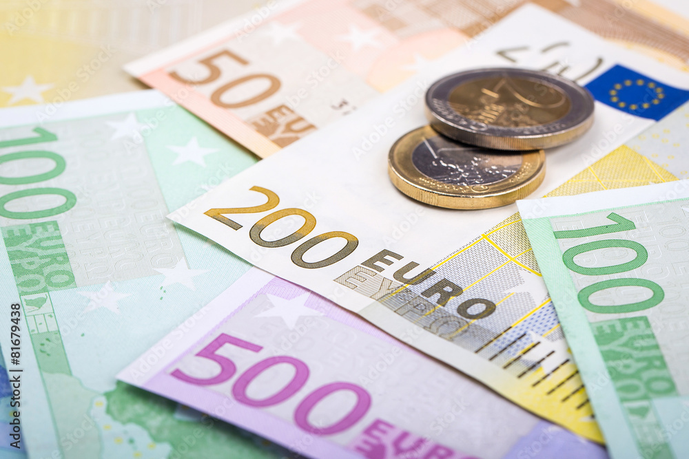 Closeup of euro banknotes and coins