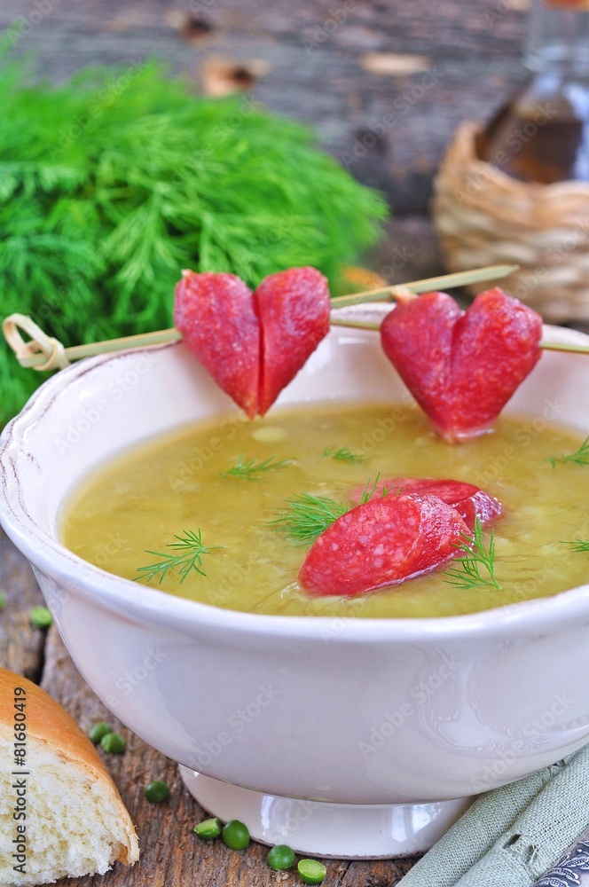 Appetizing pea soup with bacon and sausage Appetizing pea soup with bacon and sausage