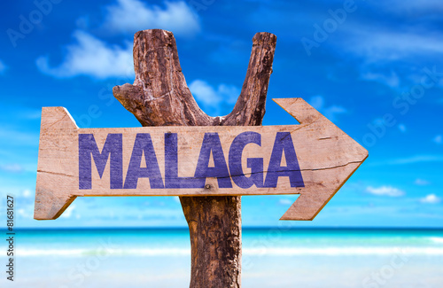 Malaga wooden sign with beach background
