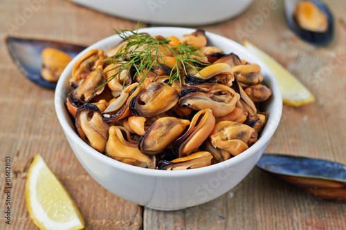 Cooked mussel with herbs and wine photo