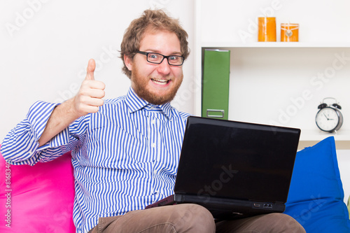 Man has joy at the computer photo