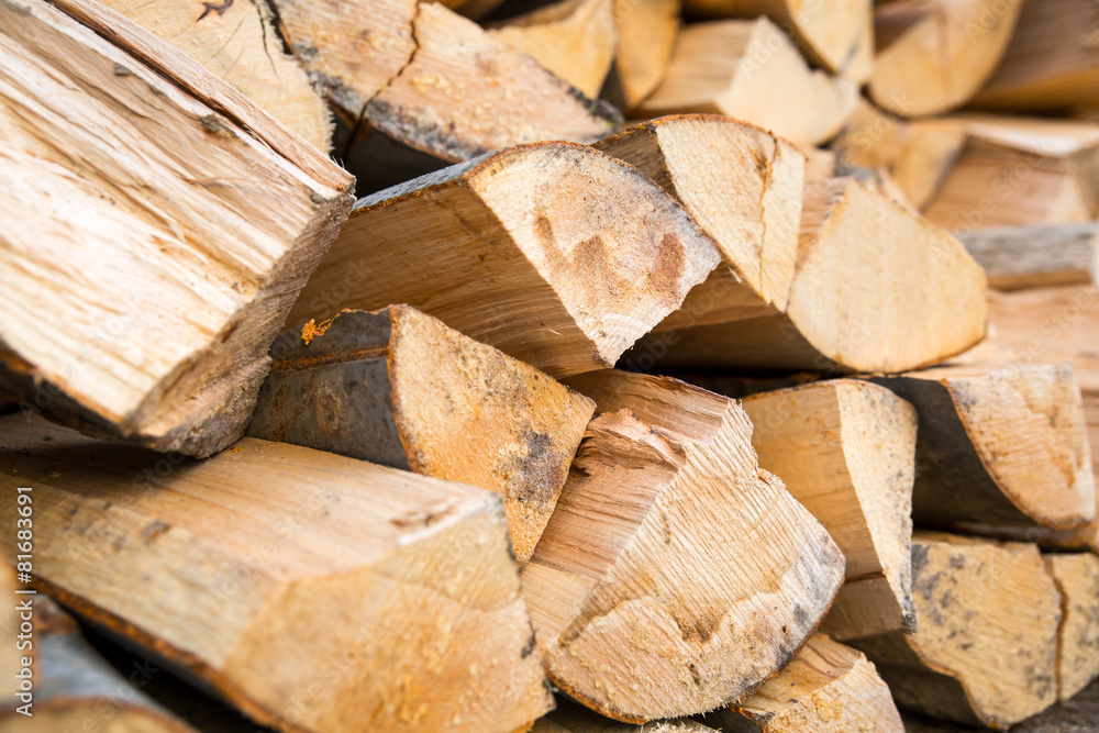 Dry chopped firewood logs ready for winter. Selective focus Dry chopped firewood logs ready for winter. Selective focus