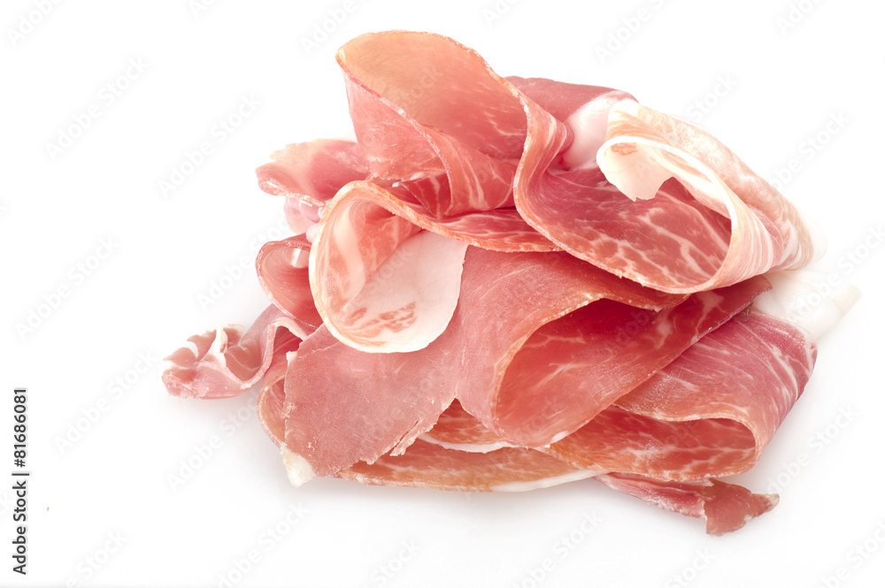 Italian prosciutto crudo ,raw ham leg sliced on white Italian prosciutto crudo ,raw ham leg sliced on white