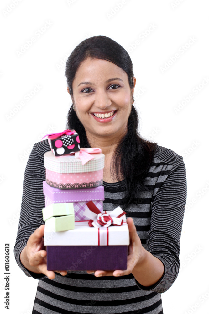 Young woman holding boxes against white Young woman holding boxes against white