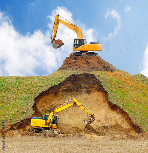 Excavators digging big hole. photo