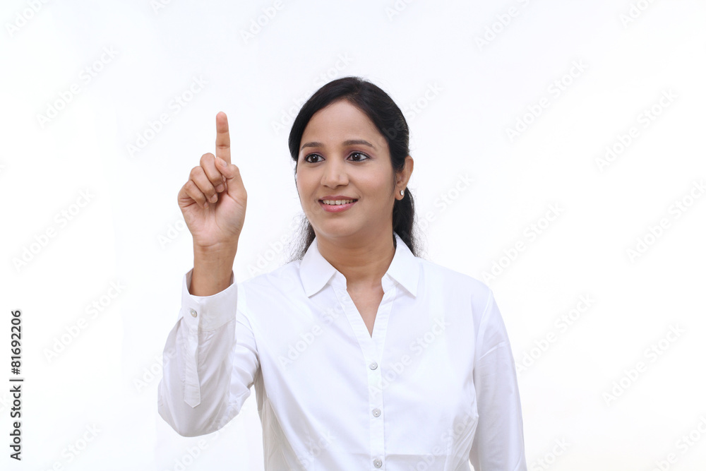 Young businesswoman touching virtual screen Young businesswoman touching virtual screen