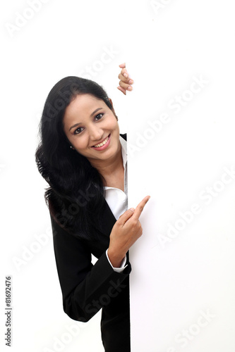 happy business woman showing blank signboard