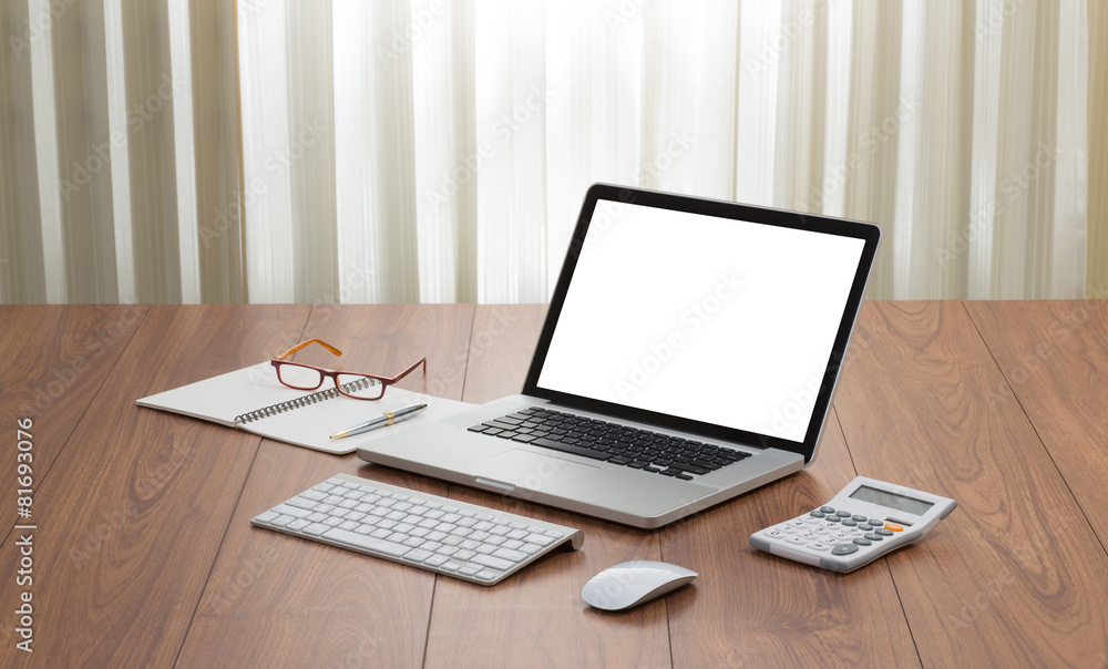 Blank screen laptop computer with office accessories on wooden t Blank screen laptop computer with office accessories on wooden t