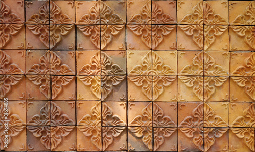 Decorative orange tone color  terracotta tiles wall photo