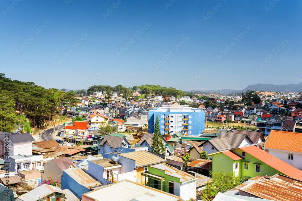 Many colorful houses of Da Lat city (Dalat) on the blue sky back