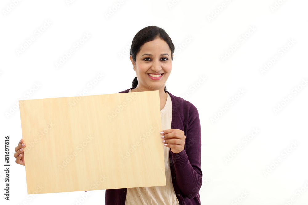 Smiling young Woman holding blank wood sheet Smiling young Woman holding blank wood sheet