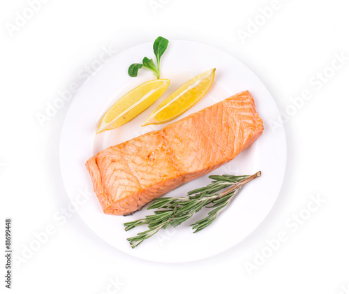 Canvas Print Fried salmon fillet on plate