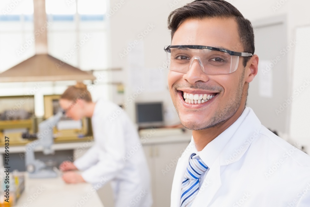 Fototapeta premium Happy scientist smiling at camera
