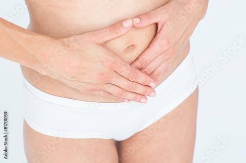 Woman touching her belly