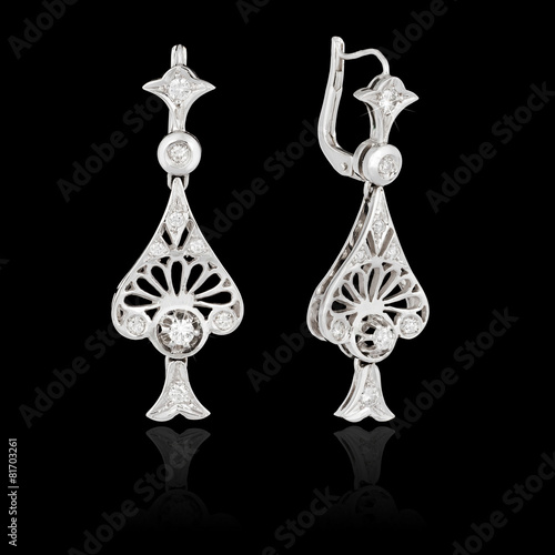 Diamond earrings isolated on the black background
