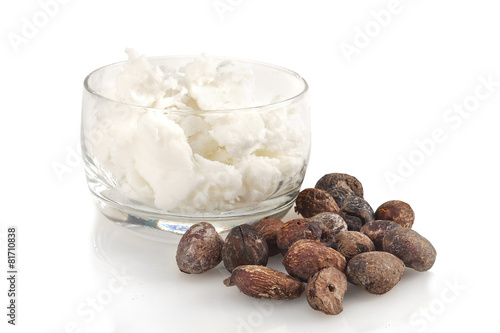 shea nuts near butter on white background