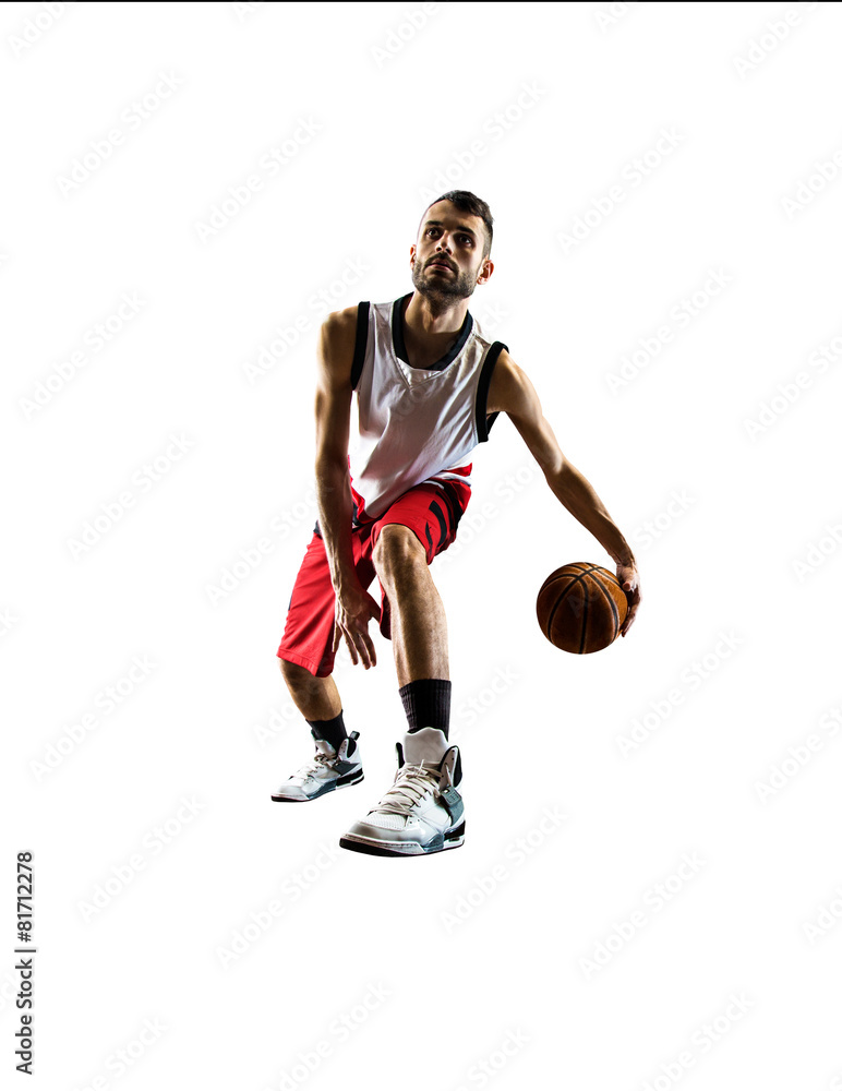 Isolated basketball player in action is flying high Isolated basketball player in action is flying high