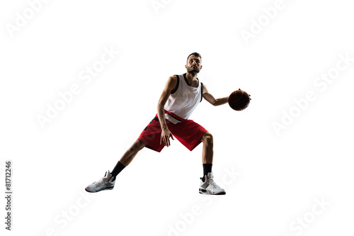 Isolated basketball player in action is flying high